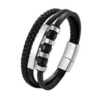 Black braided leather bracelet with silver metal accents on a white background
