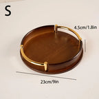 Wooden tray with gold handles and measurements on a white background