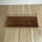 Wicker tray with dimensions on a wooden surface