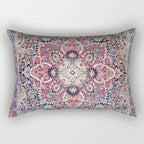 Decorative pillow with a colorful paisley pattern on a white background