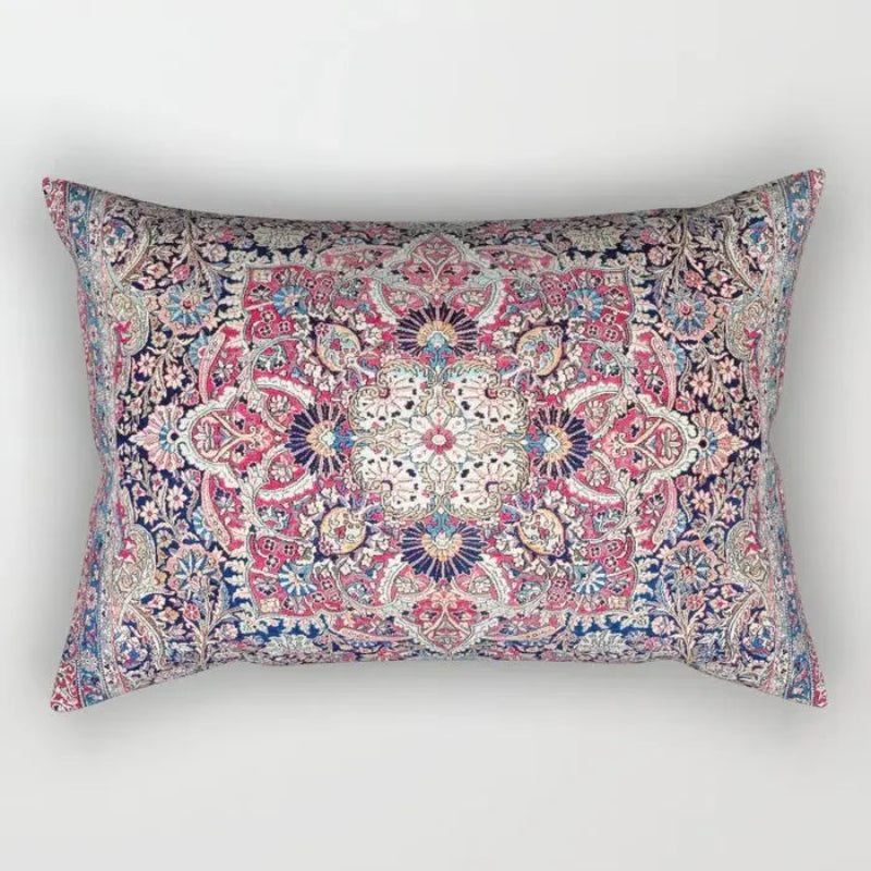 Decorative pillow with a colorful paisley pattern on a white background