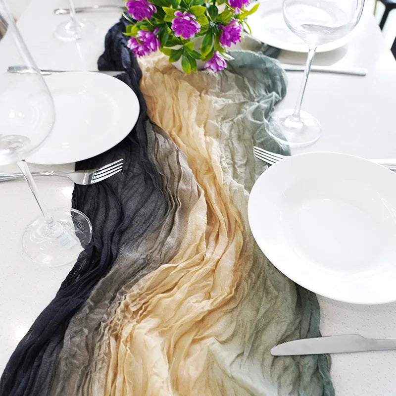 Colorful table runner with flowers and cutlery on a white tablecloth