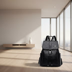 Black backpack with a brand logo on a white background
