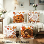 Three decorative throw pillows with autumn-themed printed designs are arranged on a cream sofa in a styled living room. The pillows feature illustrations of a fox, a hedgehog, and autumn leaves, with text reading 'Autumn Whispers,' 'Cozy Days Ahead,' and 'This product is a 2D flat print.