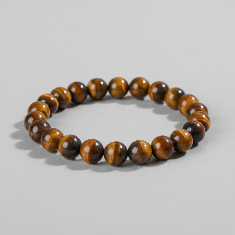 Brown beaded bracelet on a wooden surface with 'Self-Love' text