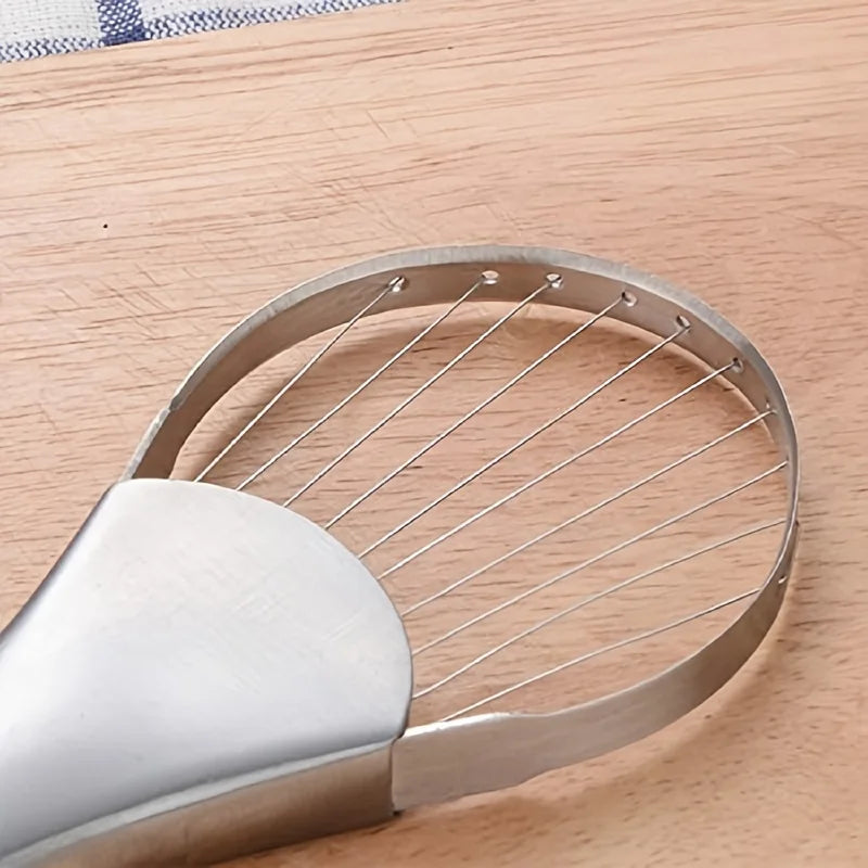 Metallic kitchen tool on a wooden surface