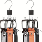 Two pairs of leather belts with metal buckles on hangers against a white background.