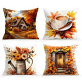 Four square decorative throw pillows arranged in a 2x2 grid on a white background. The top-left pillow shows a autumn cottage scene with orange trees and a path.