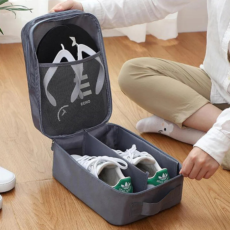 Person organizing a gray shoe organizer with white sneakers inside on a wooden floor.