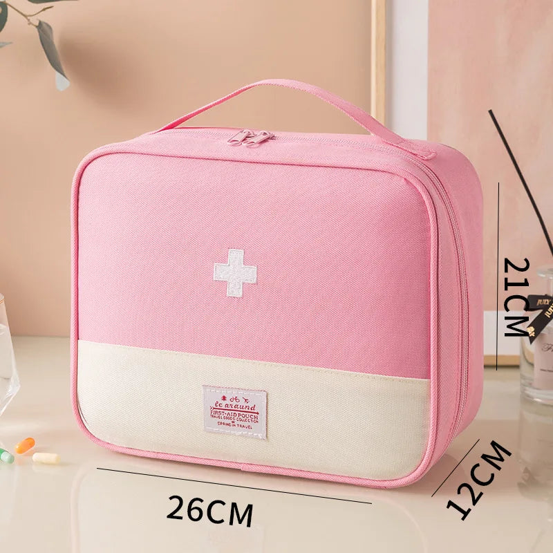 Pink first aid kit with measurements on a light background