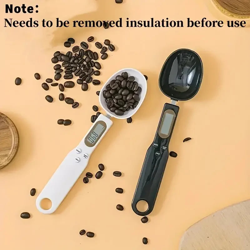 Two digital measuring spoons with coffee beans on a beige surface, accompanied by text indicating insulation removal.