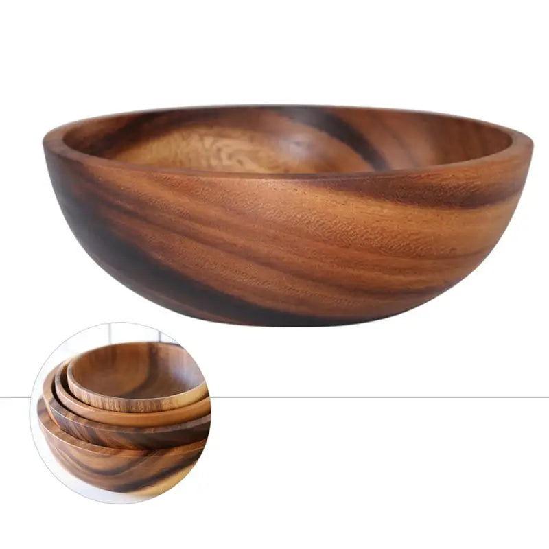 The EMESA HOME Natural Wooden Bowl is handcrafted from Acacia wood, perfect for serving fruit or salad. Its elegant design adds a natural touch to any kitchen. - Emesa Home