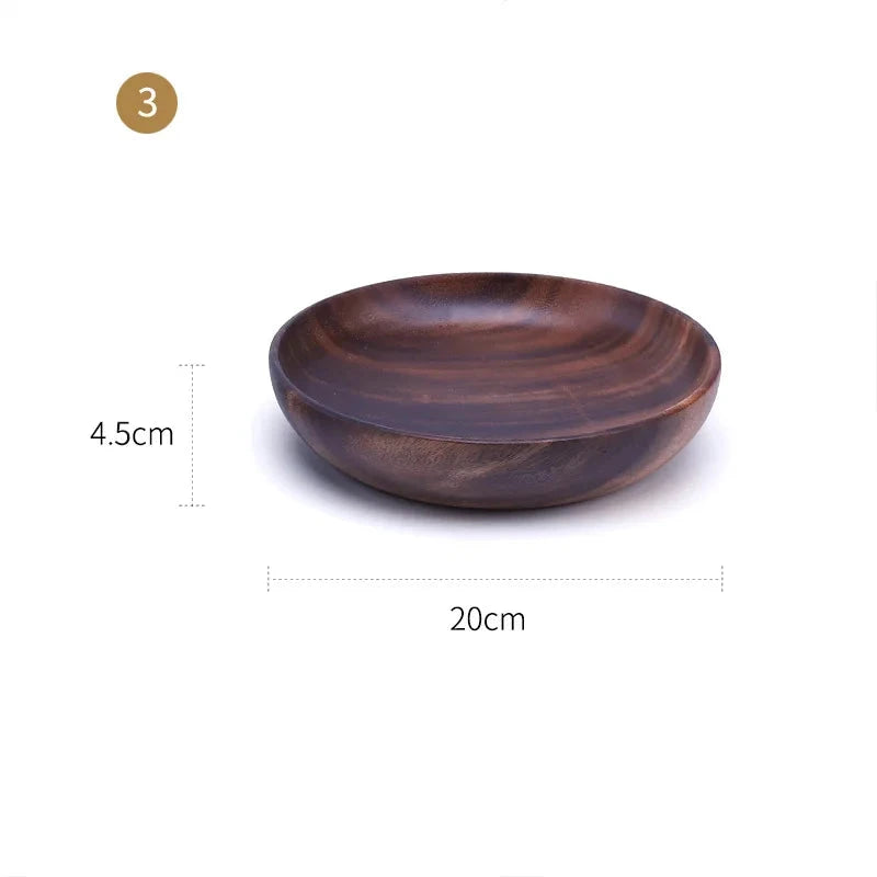 The EMESA HOME Natural Wooden Bowl is handcrafted from Acacia wood, perfect for serving fruit or salad. Its elegant design adds a natural touch to any kitchen. - Emesa Home