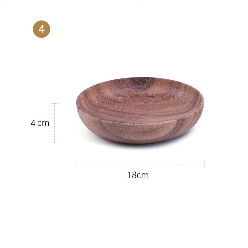 The EMESA HOME Natural Wooden Bowl is handcrafted from Acacia wood, perfect for serving fruit or salad. Its elegant design adds a natural touch to any kitchen. - Emesa Home