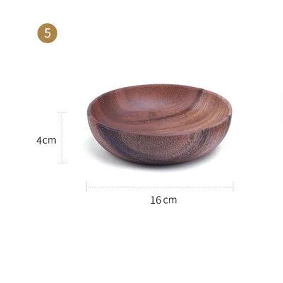 The EMESA HOME Natural Wooden Bowl is handcrafted from Acacia wood, perfect for serving fruit or salad. Its elegant design adds a natural touch to any kitchen. - Emesa Home