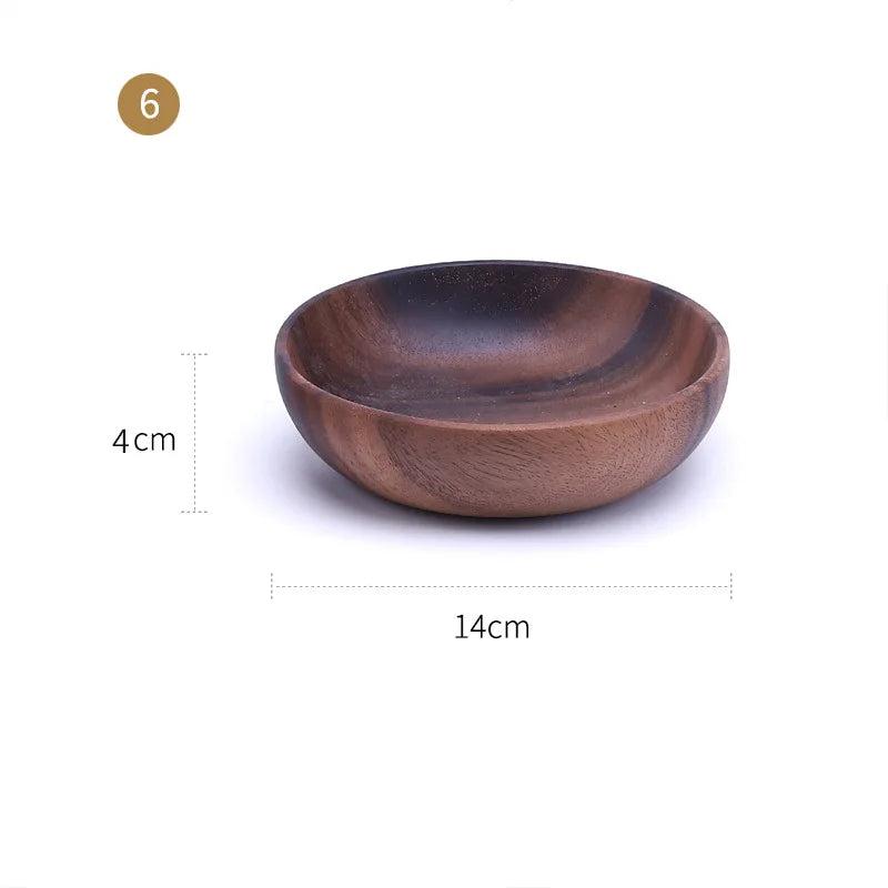 The EMESA HOME Natural Wooden Bowl is handcrafted from Acacia wood, perfect for serving fruit or salad. Its elegant design adds a natural touch to any kitchen. - Emesa Home