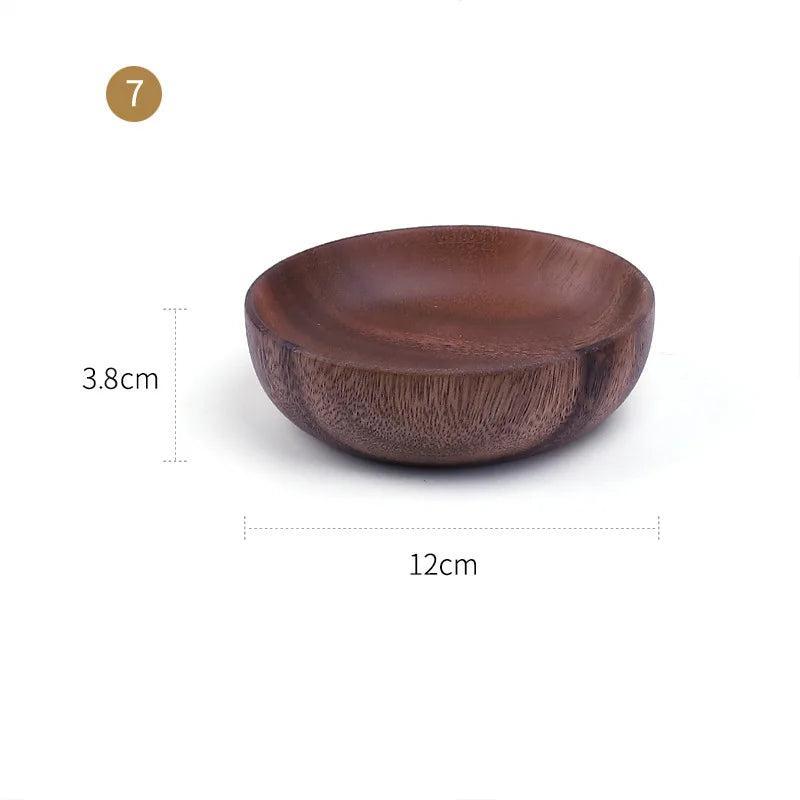 The EMESA HOME Natural Wooden Bowl is handcrafted from Acacia wood, perfect for serving fruit or salad. Its elegant design adds a natural touch to any kitchen. - Emesa Home